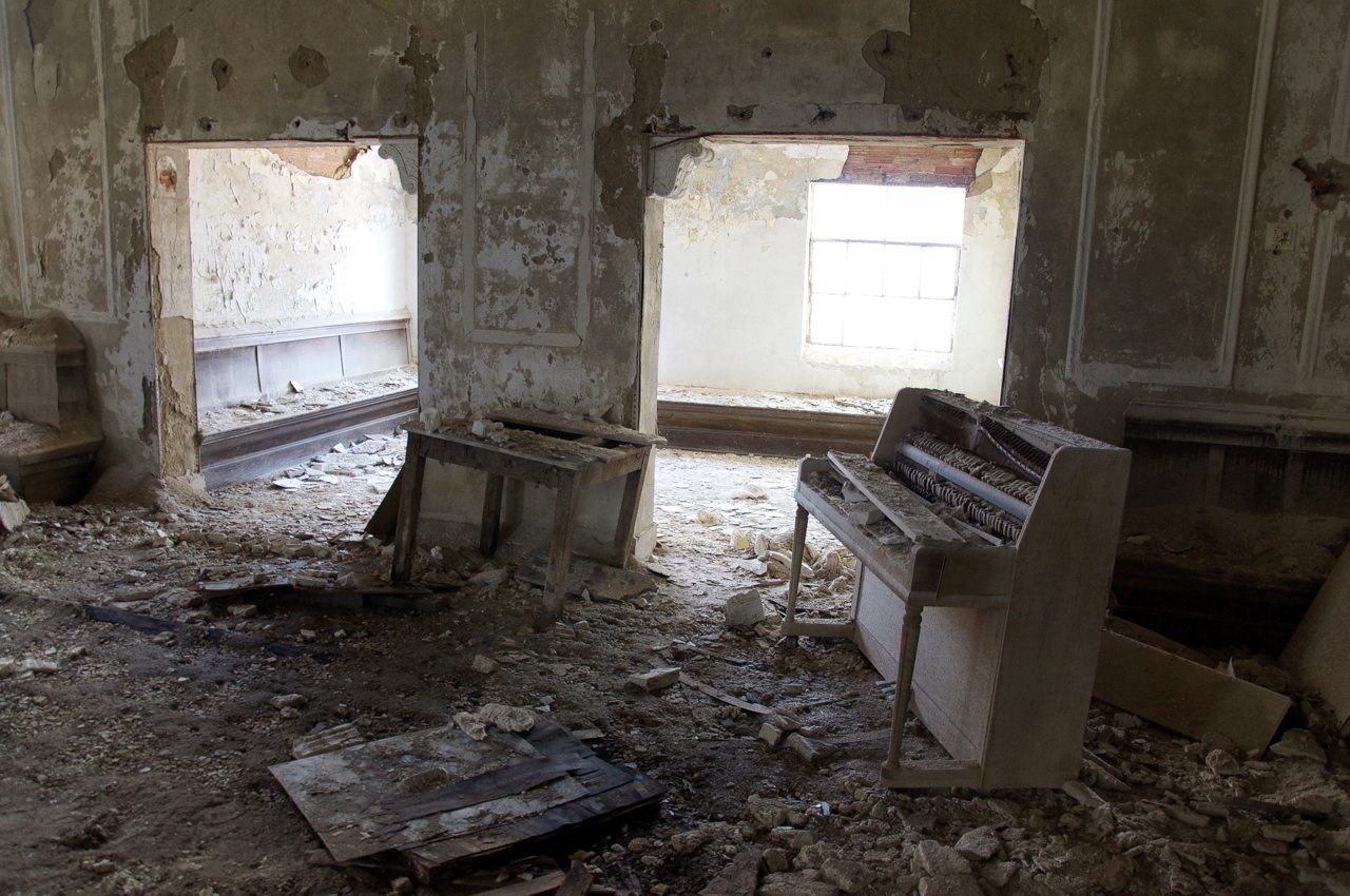 forgotten church with empty piano